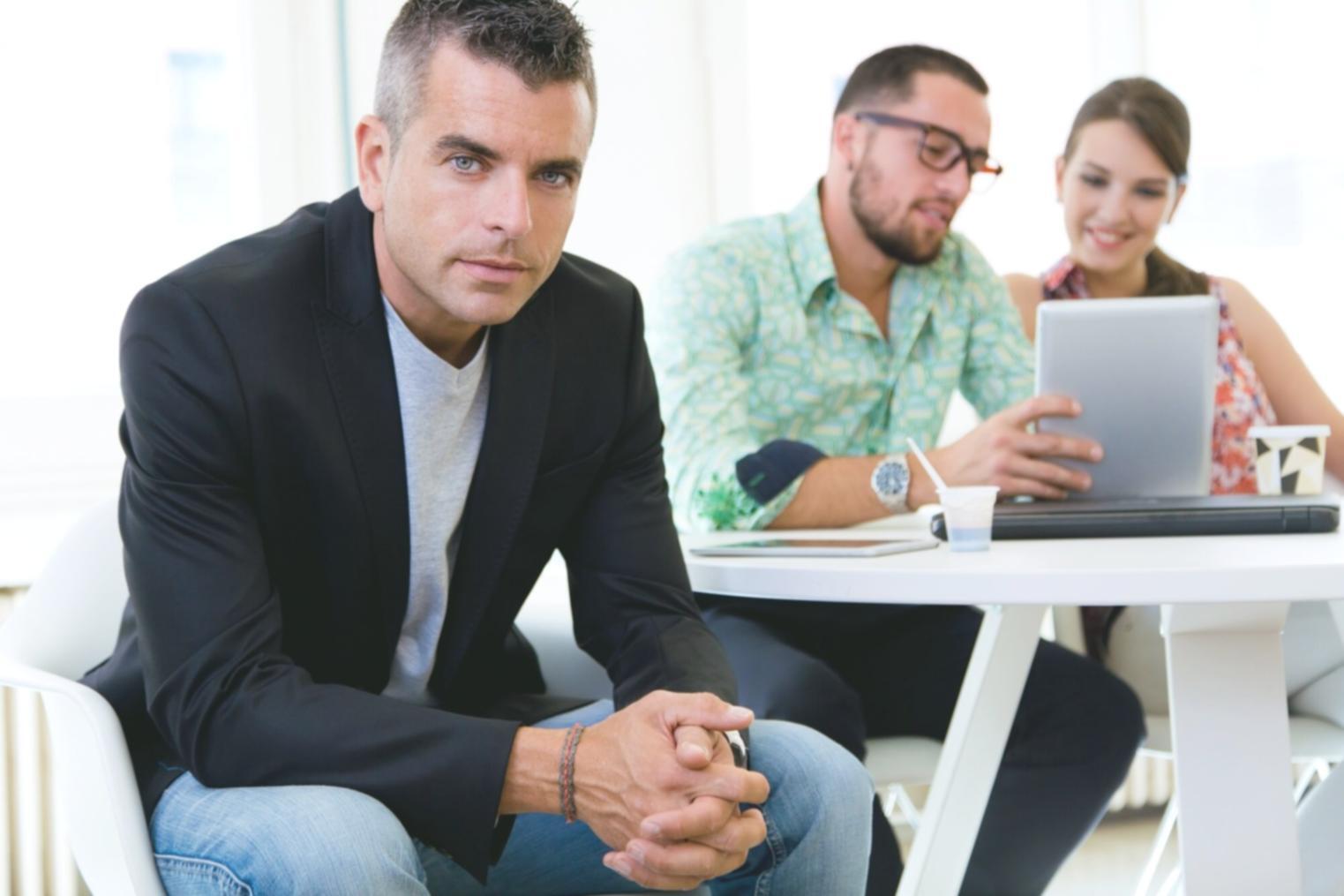 Business owner reviewing financial documents with clarity